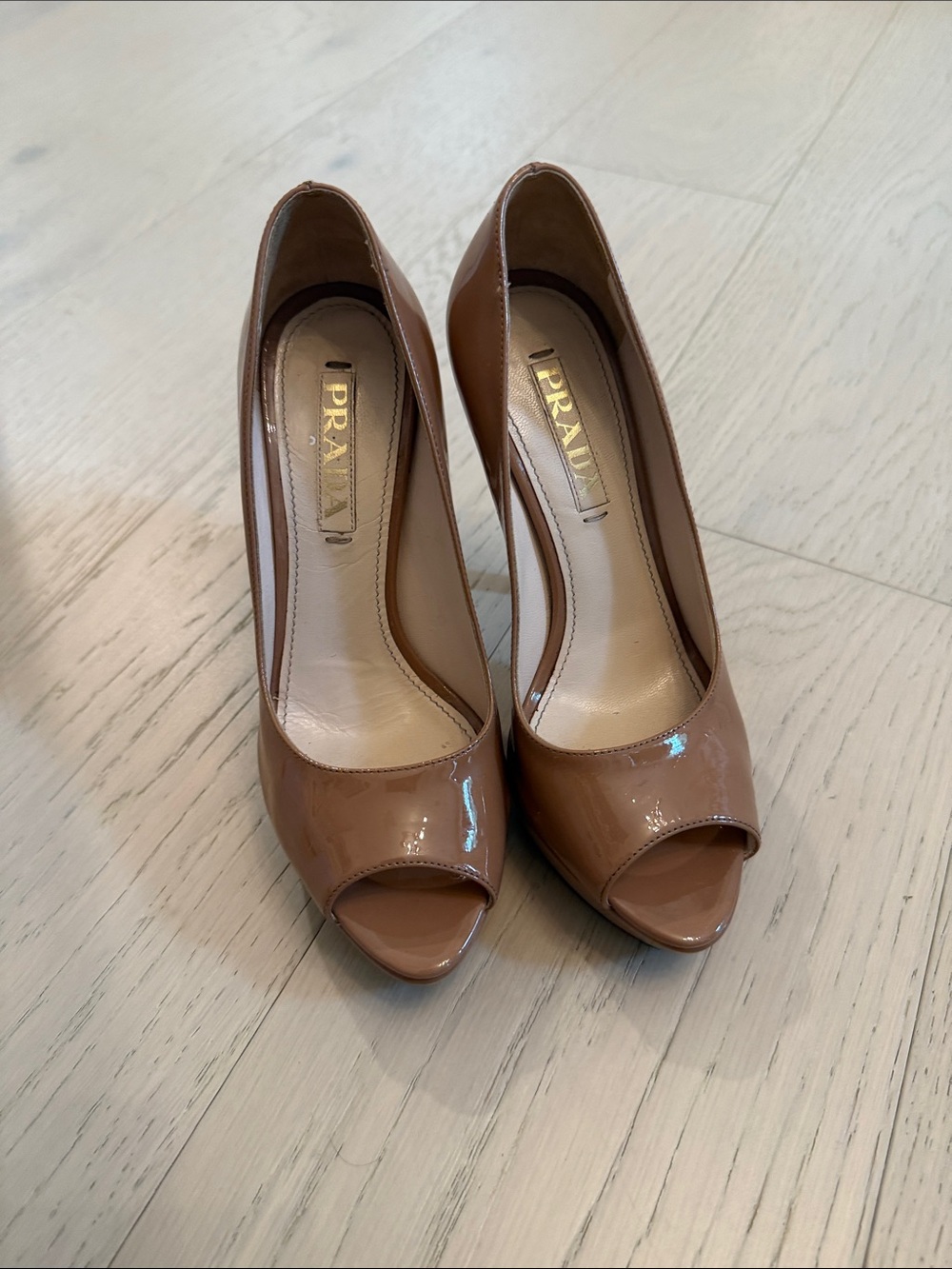 Prada Patent Leather Peep-Toe Pumps in Tan
